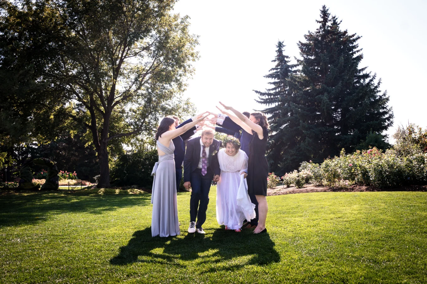 wedding party in Calgary made a tunnel that newlyweds have to pass through