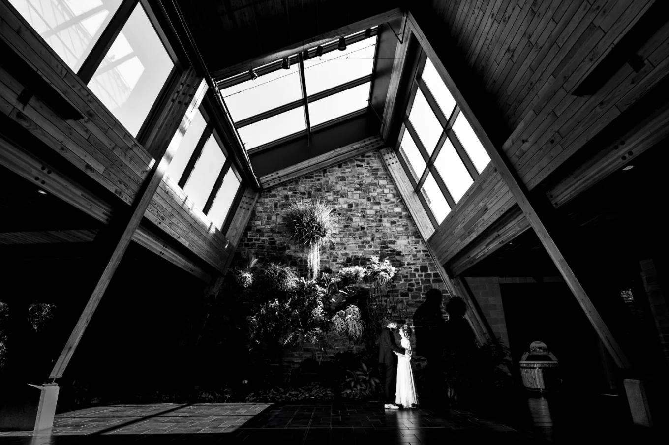 Wedding Portrait of the bride and groom in the building with huge windows in Calgary