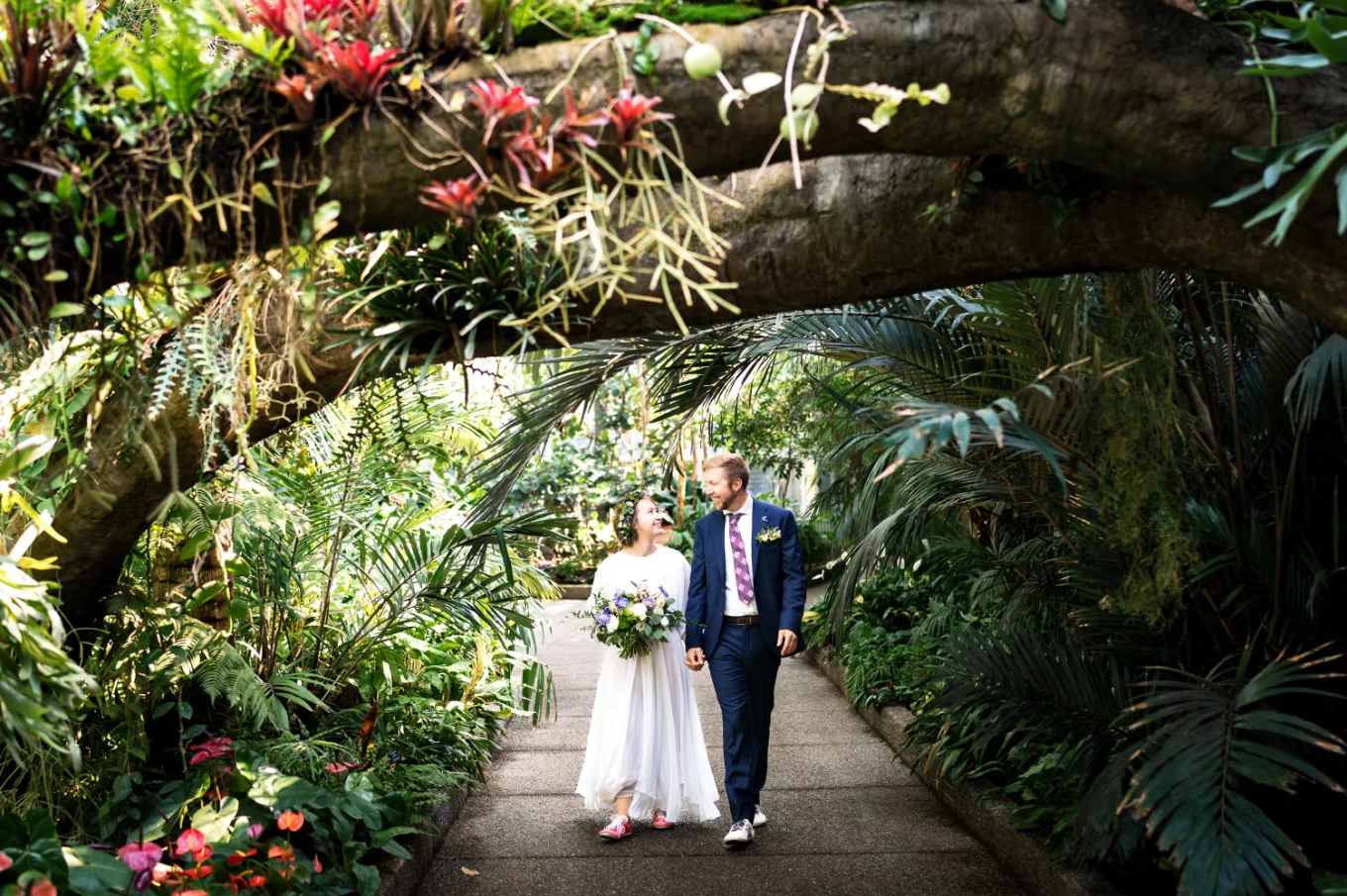 Newlyweds walks at the Calgary Zoo after their Calgary wedding