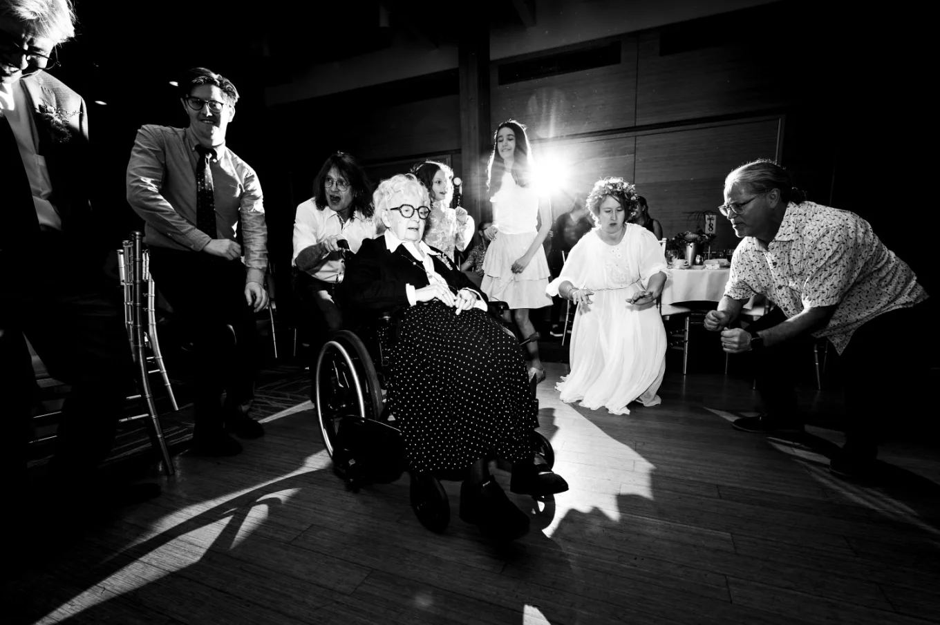 Calgary wedding dance floor photography of the bride dancing with the grandmother on the wheelchair