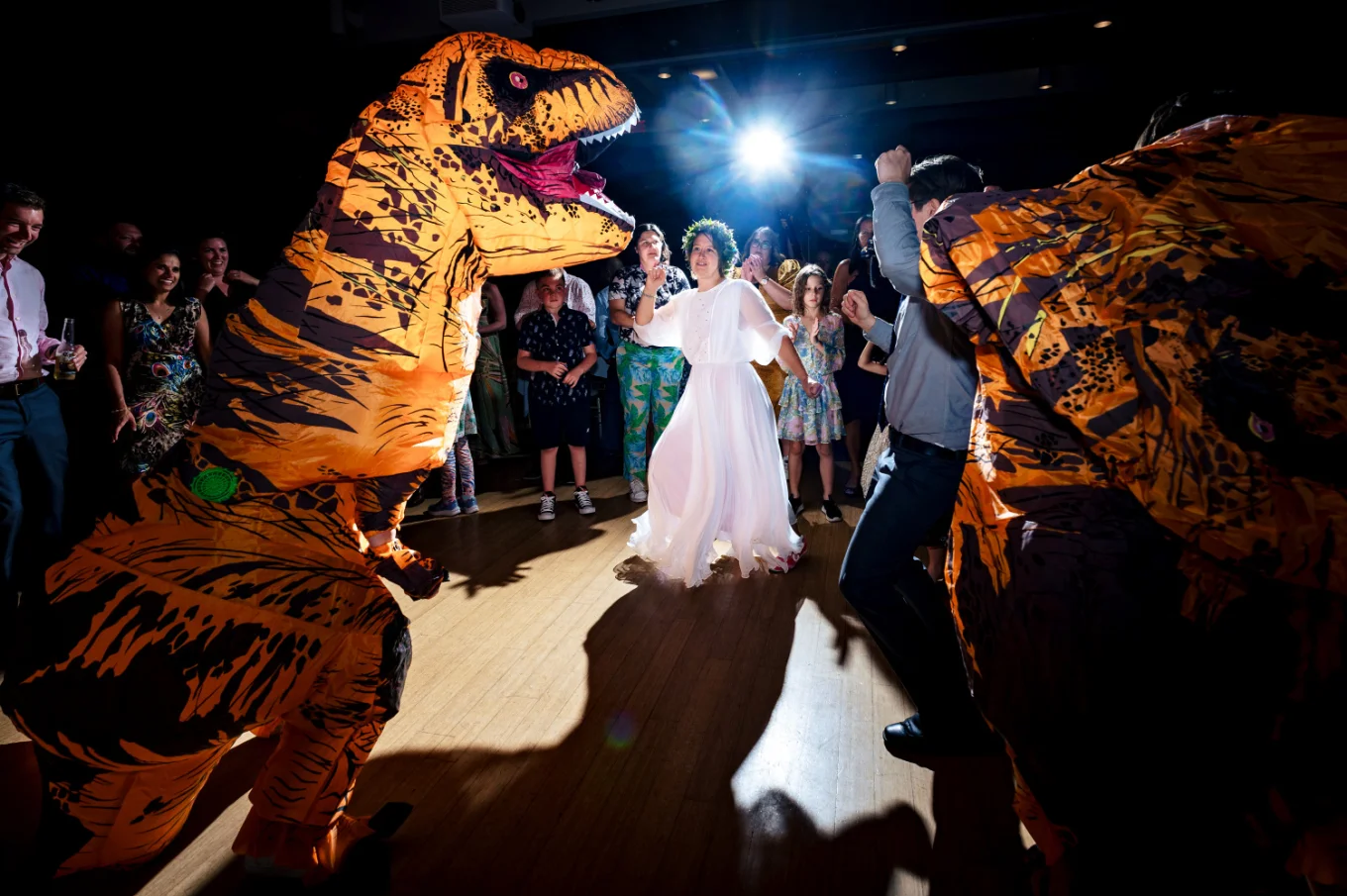 Fun Calgary dance-floor of the bride dancing whit dinosaur at the Calgary Zoo