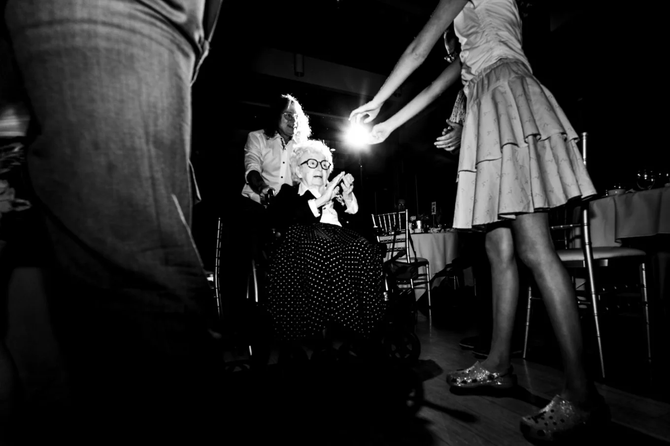 Grandmother of the bride on the wheelchair on the dance-floor