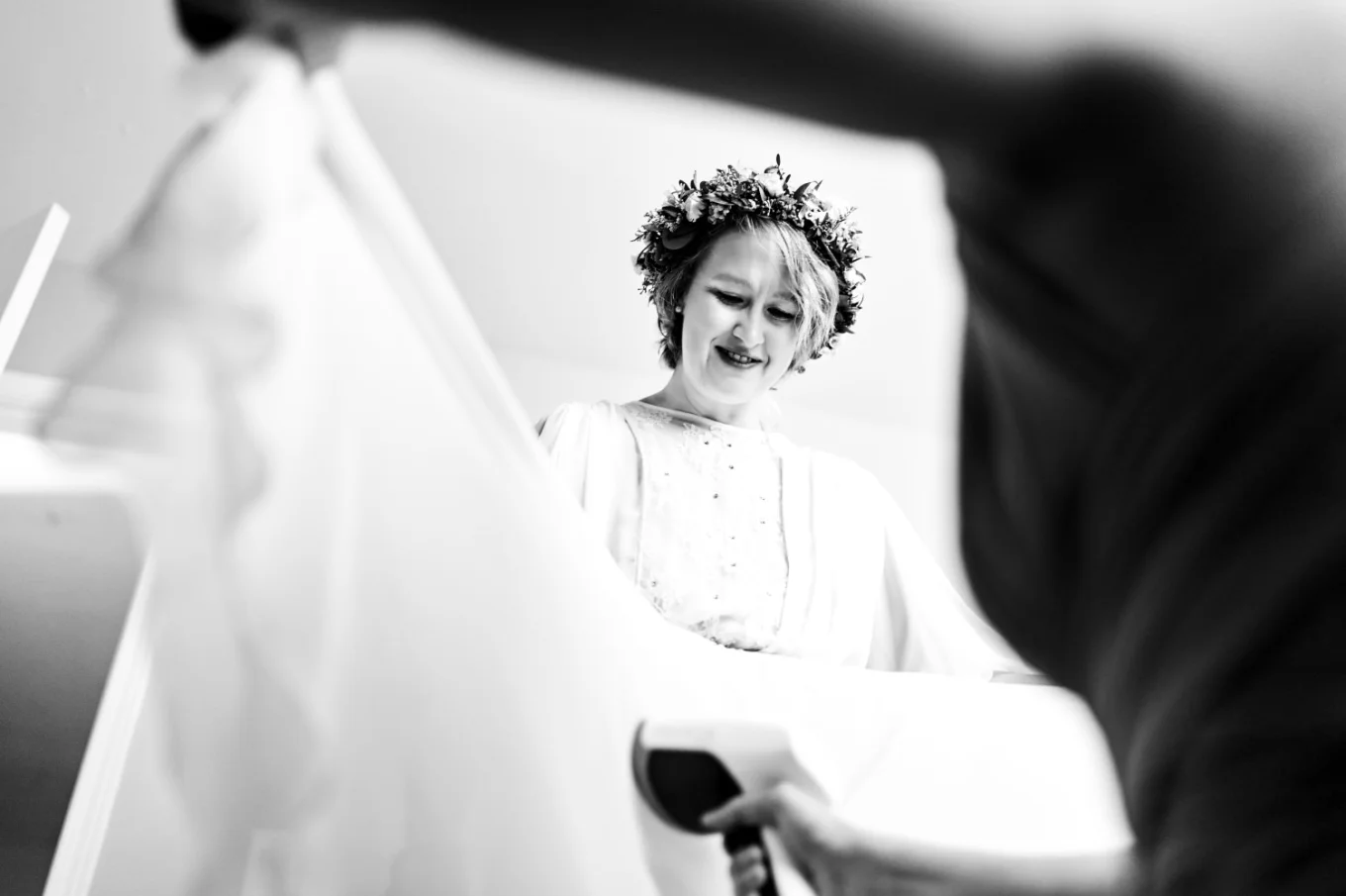 maid of honour iron the bride's wedding dress