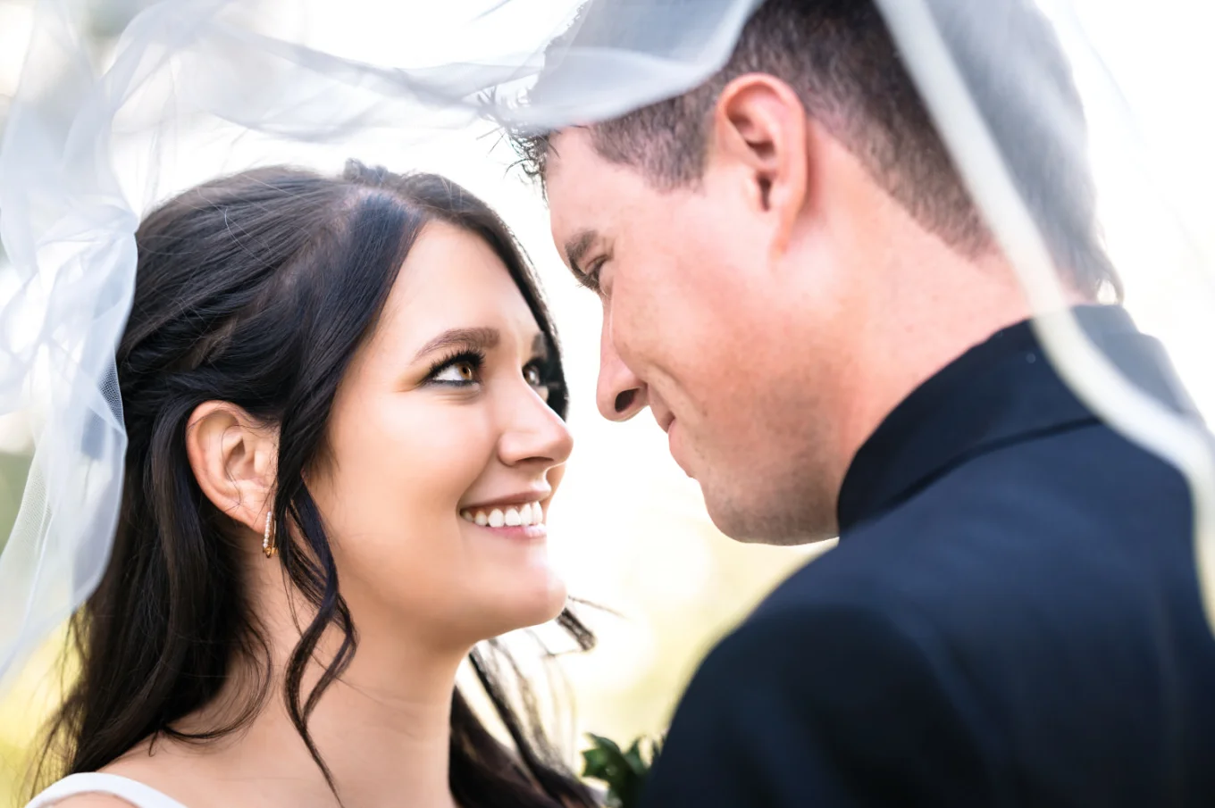 Newlyweds looking at each other with love at the Canadian Wedding