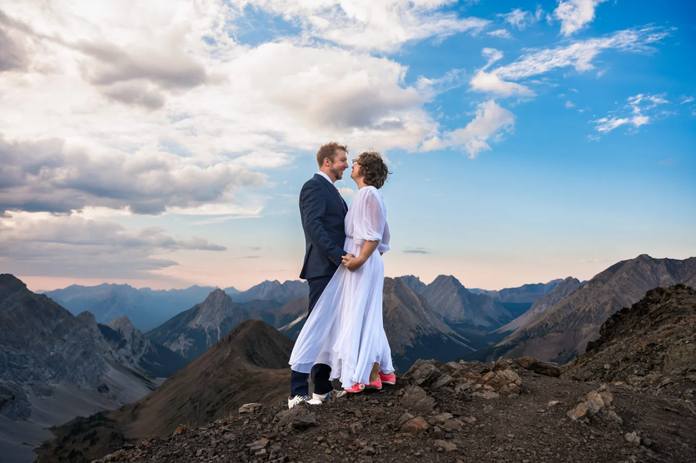 Banff Elopement Photography of the newyweds holding their hands in the Canadian Rockies