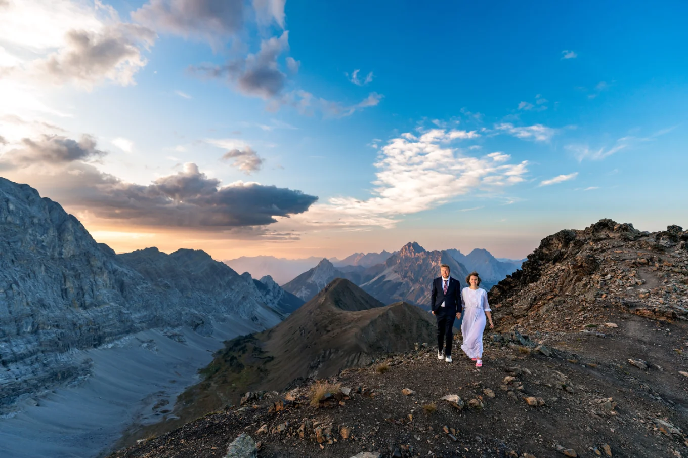 Adventure Wedding Photography of the newlyweds walking on the rigde of the mountain