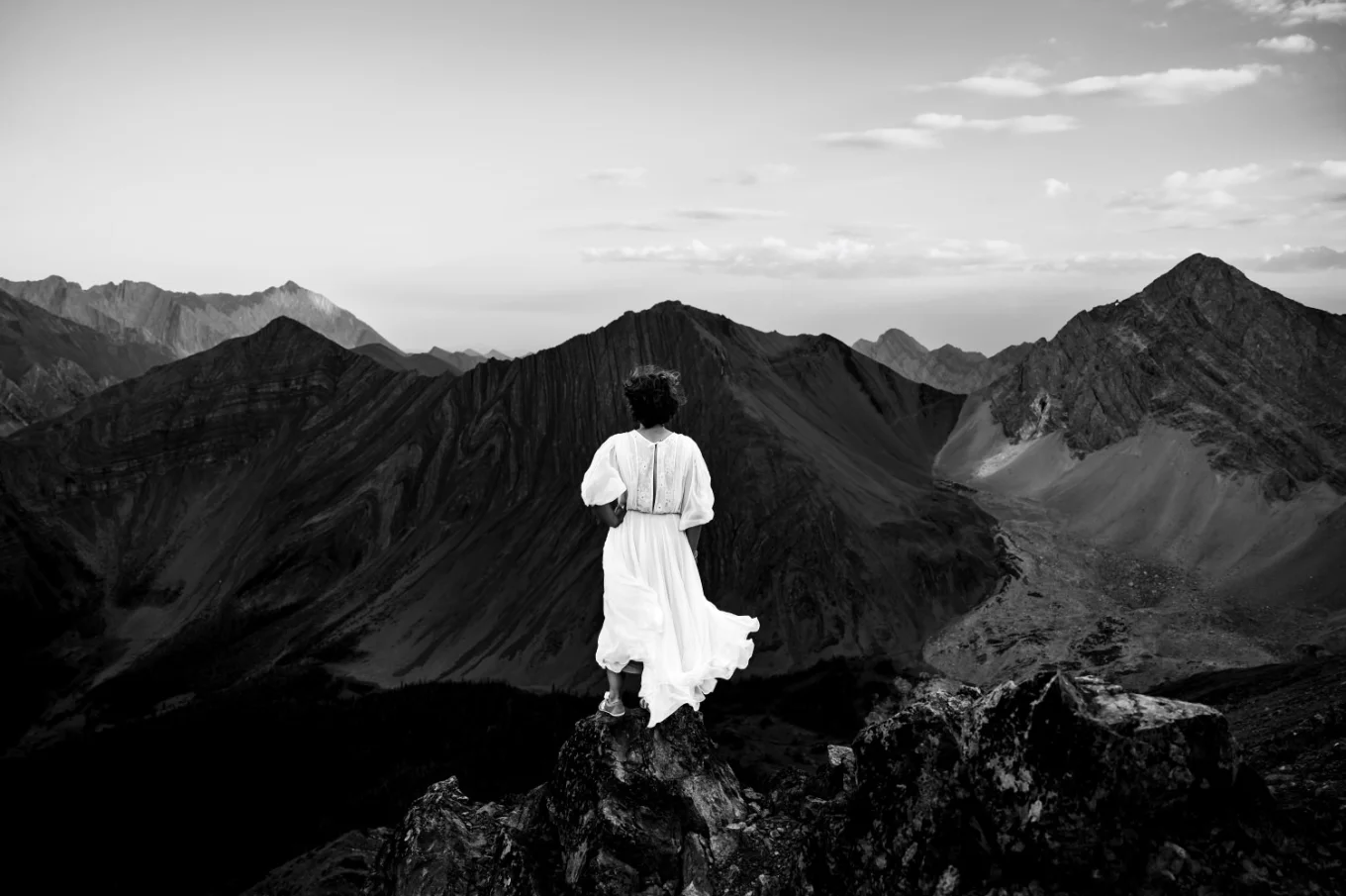 Black and White Wedding Photography of the bride looking at the Canadian Rockies