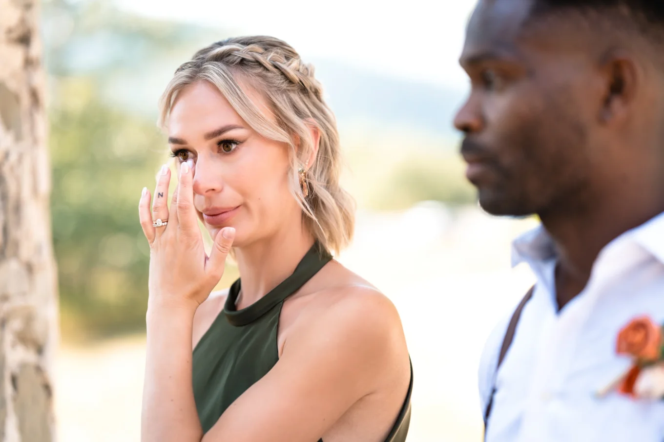 Bride of hounor whiles her tears during the wedding ceremony in Watertoon.