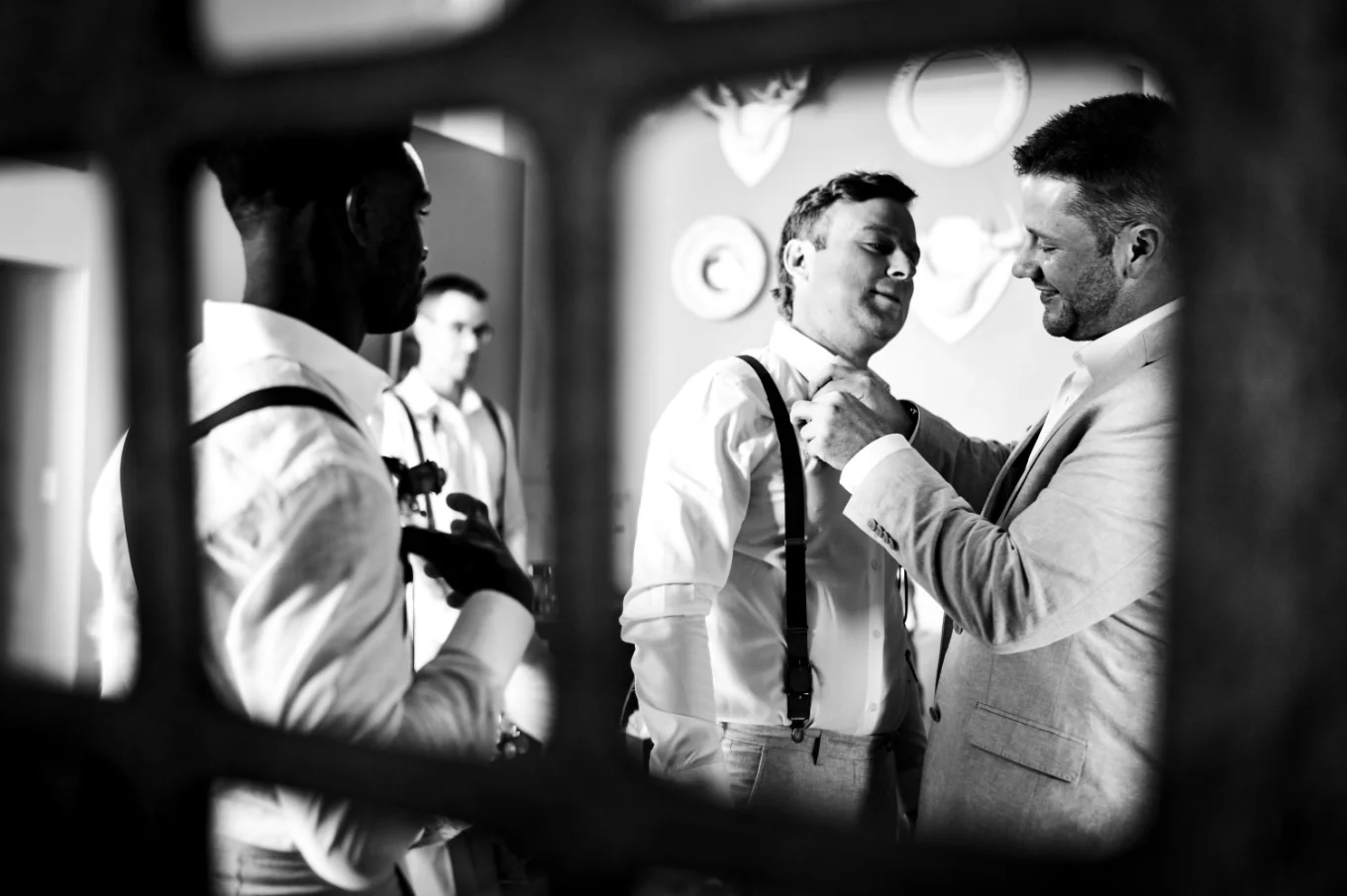 Groom helps to get ready his best friend for the Waterton wedding