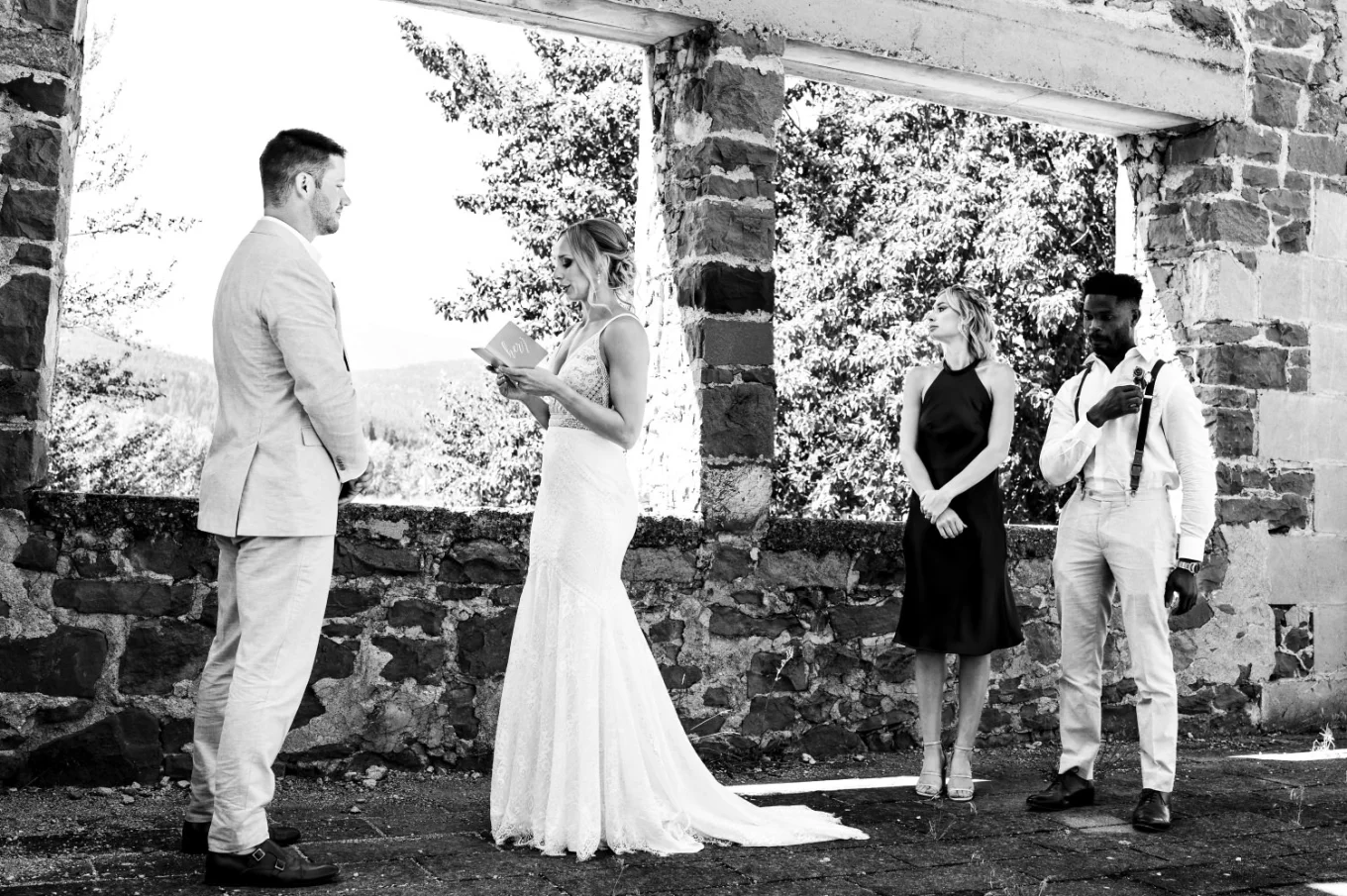 Black and white photograph of the newlyweds exchanging the vowes in Watertoon.