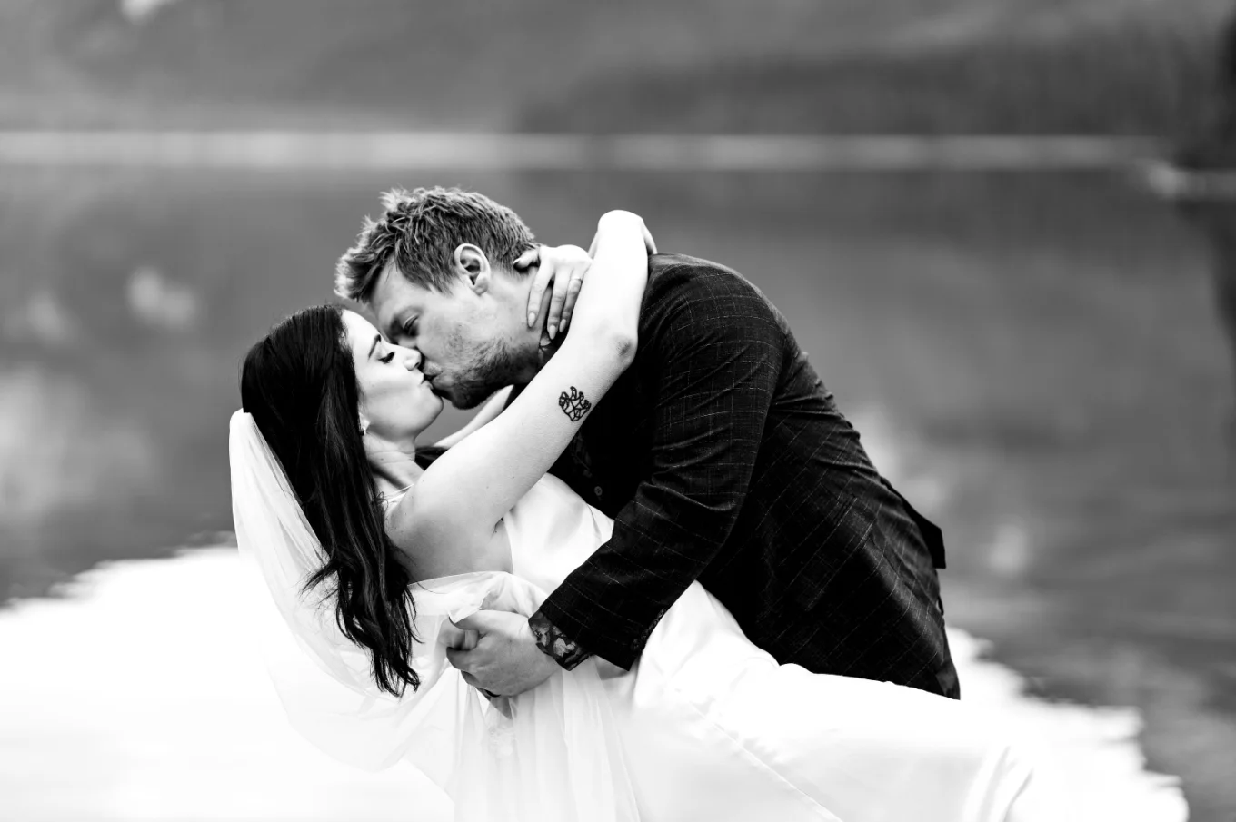 Bride and groom share a kiss.