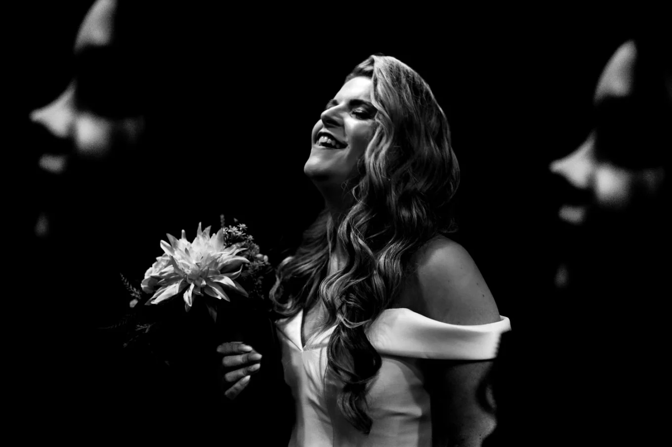 Creative, black and white photograph of the bride and the bridesmaid.