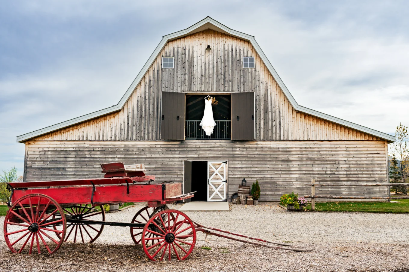 a wedding dress hanging in the sheds window on the Canadian farm in Calgary