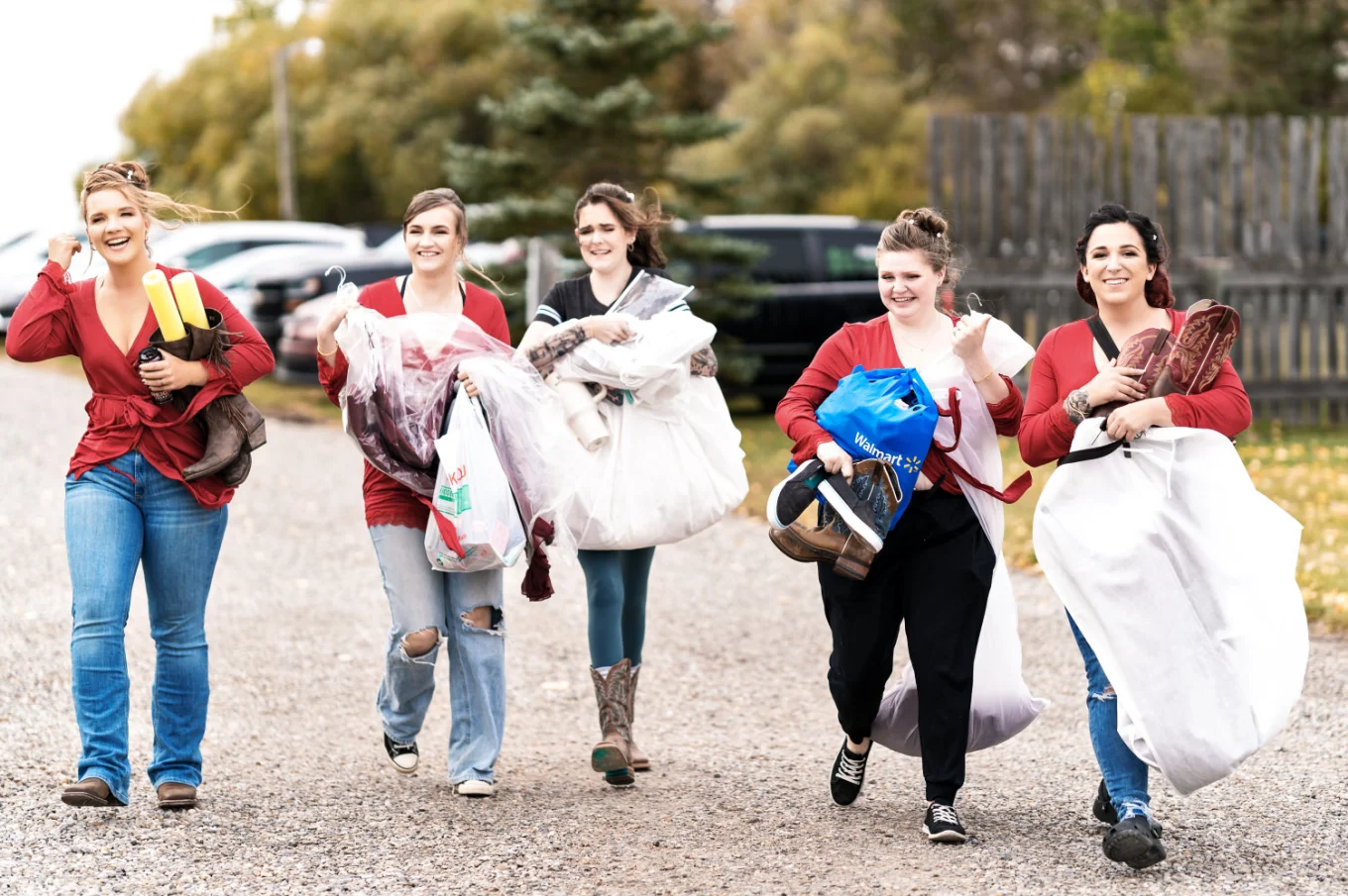 Bridal Party Walking and caring a wedding dress before wedding in Calgary