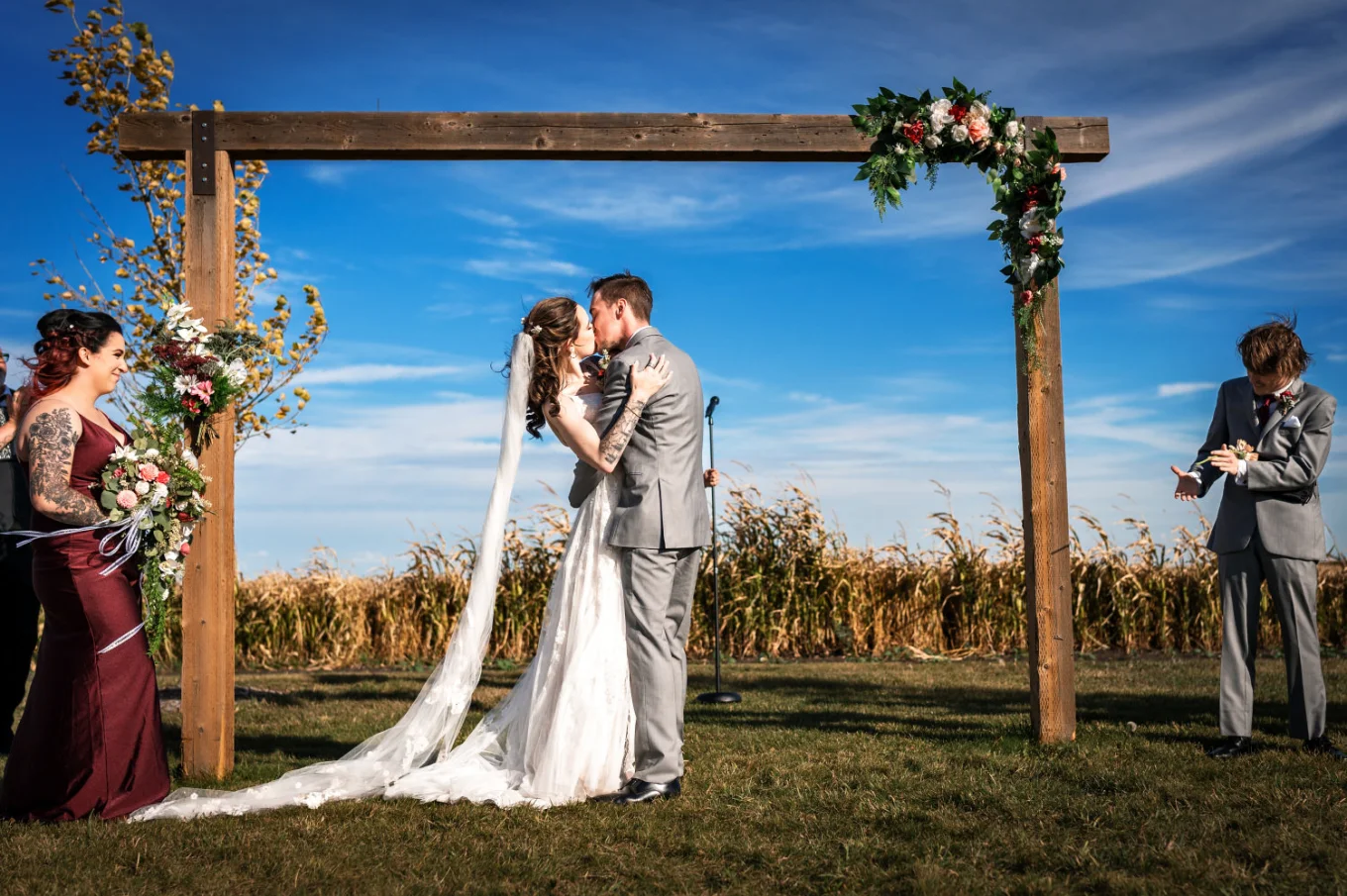 Newlyweds share a kiss. Moment captured by Calgary Wedding Photographer.