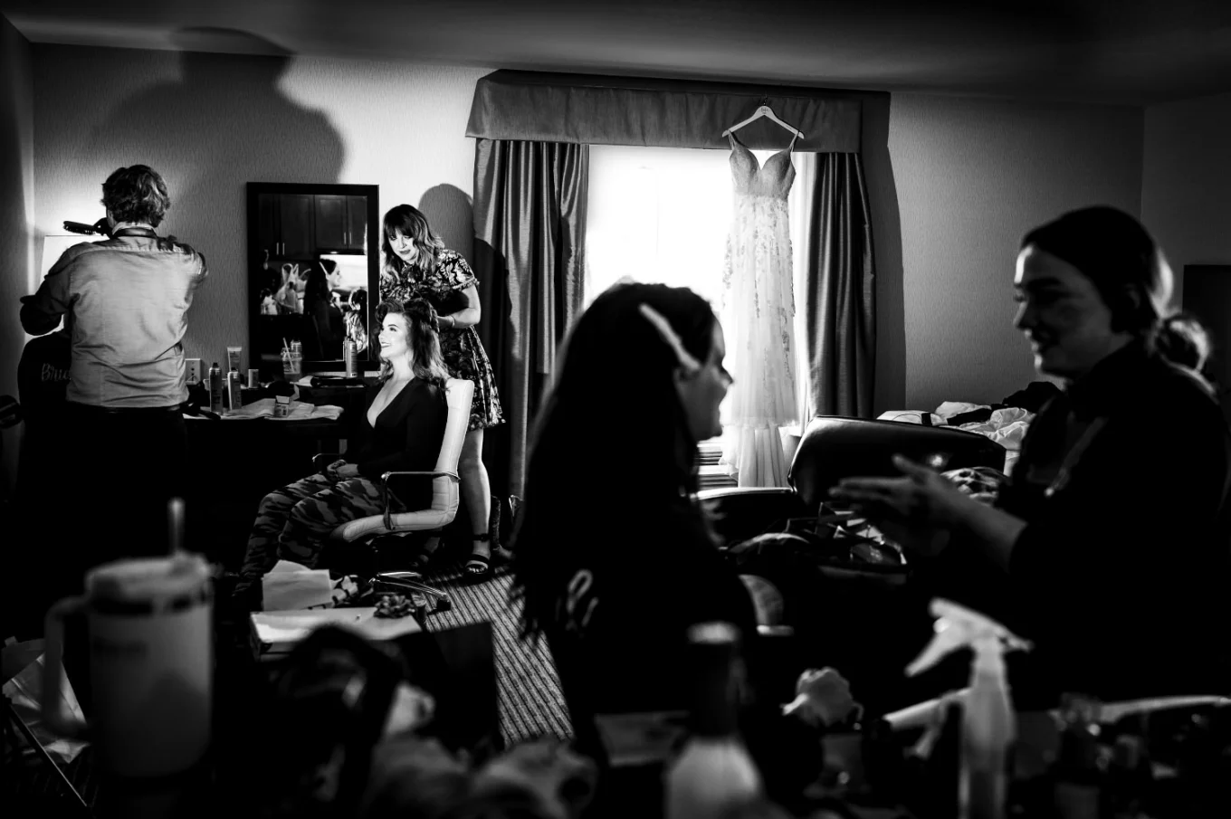 bride and bridesmaids getting hair and make up done in the hotel room in Calgary