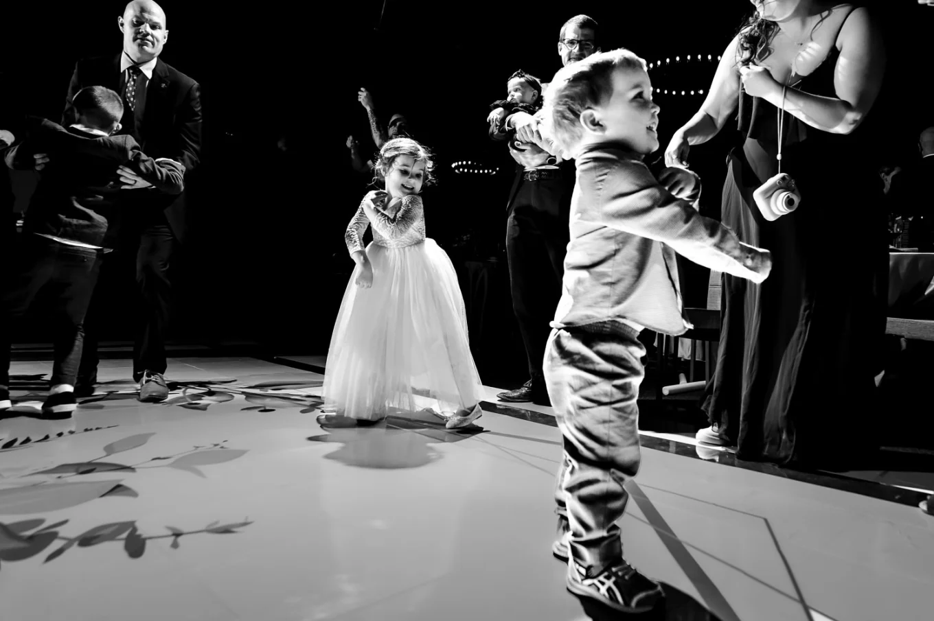 flower-girl and her little brother dance at the dancefloor