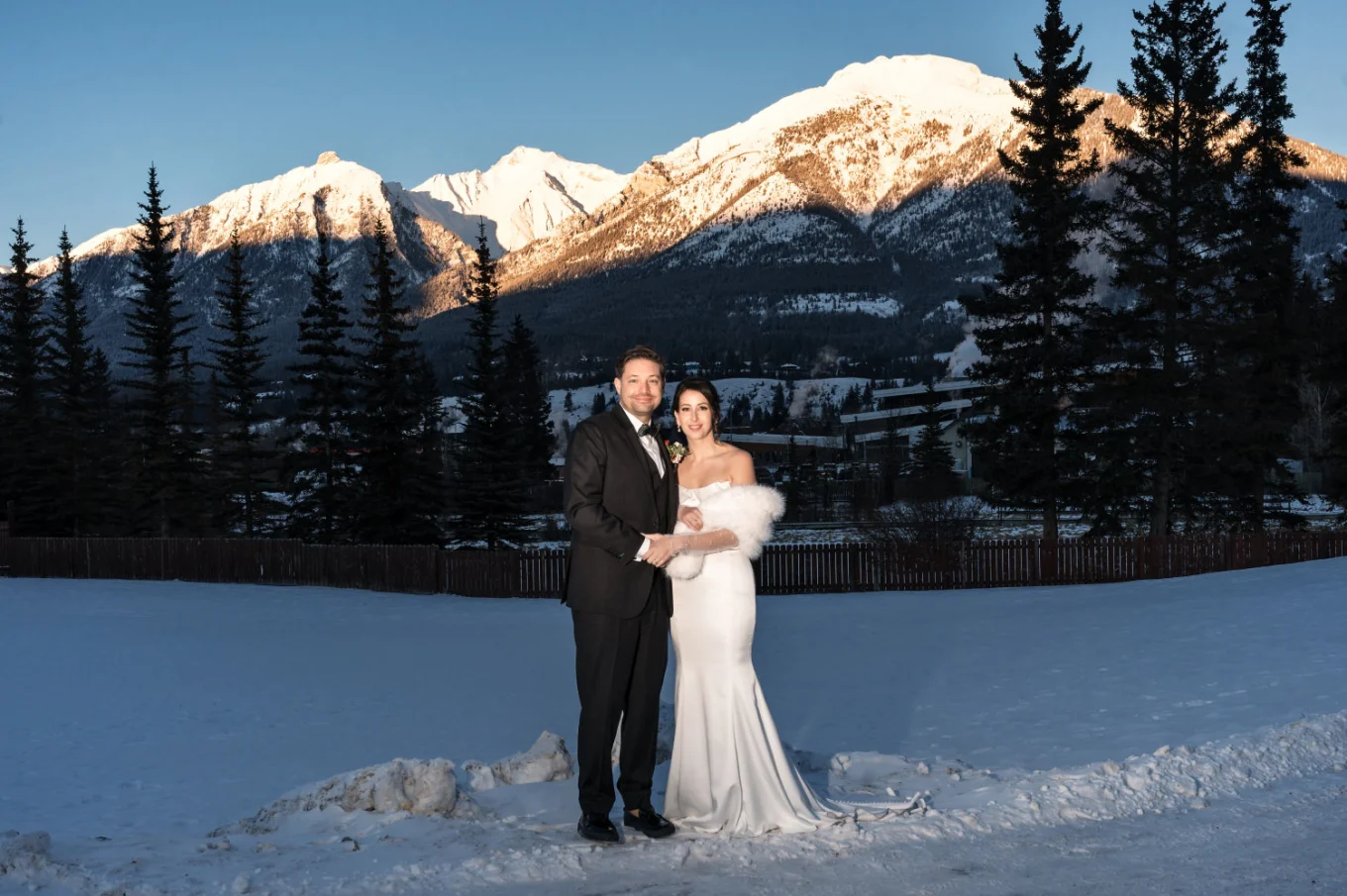 Bride and groom's portrait against Canadian Rocky Mountains in Canmore.