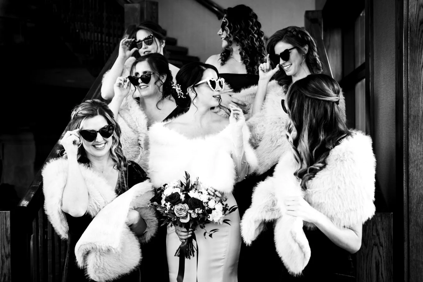 Fun wedding party in Canmore of the bride and bridesmaid wearing sunglasses