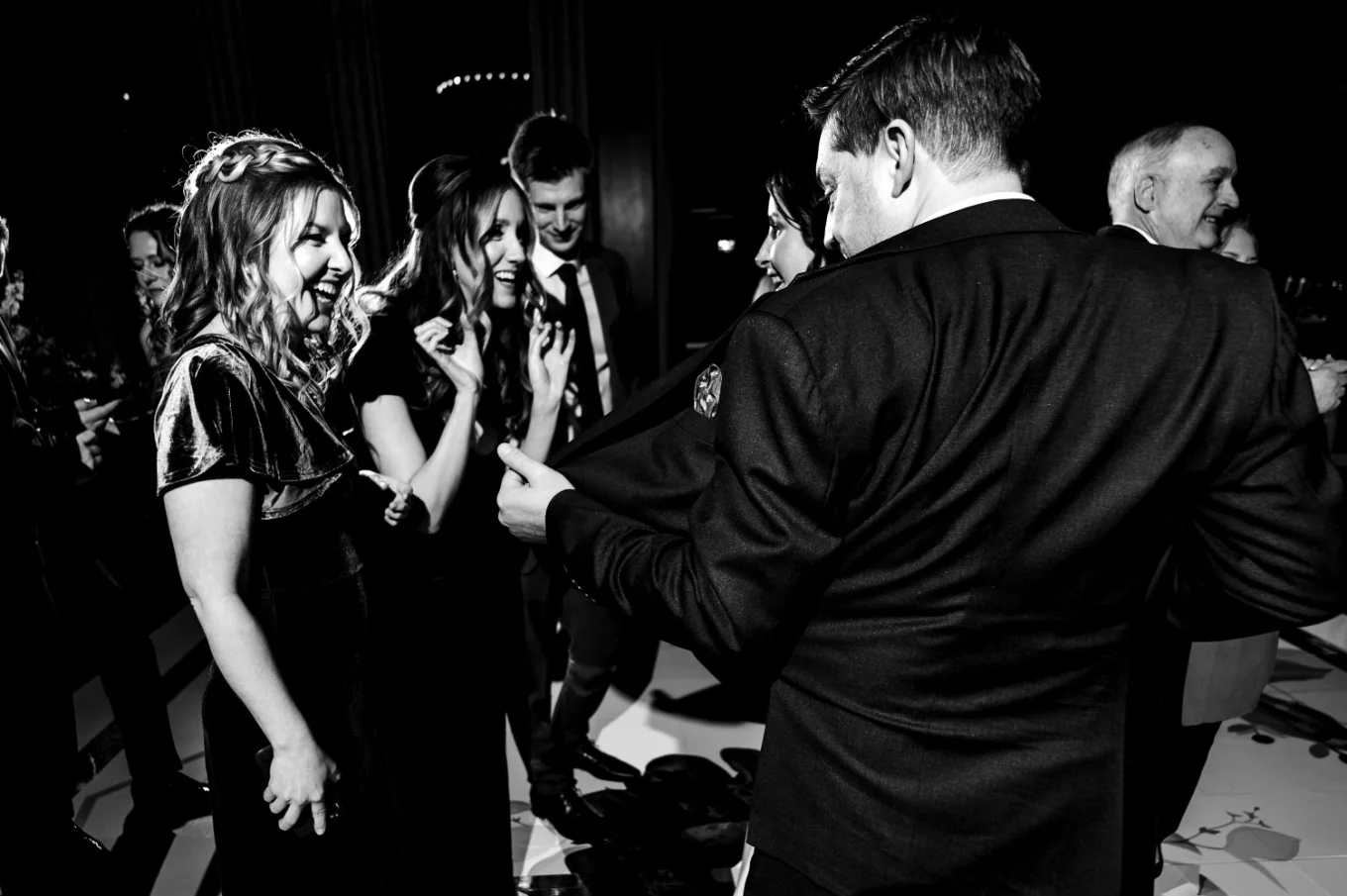 bridesmaid looking what the groom hides in the jacket