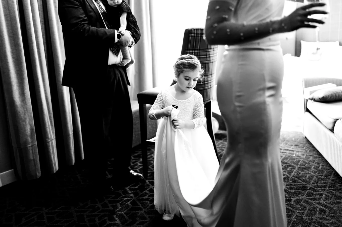 Flower girl fixes the brides wedding dress in Canmore