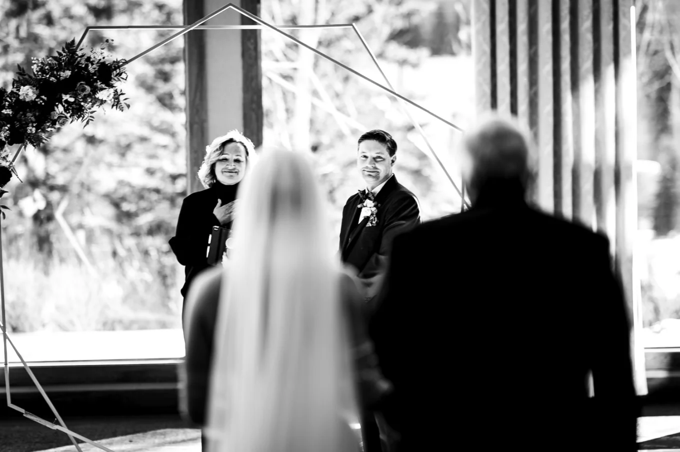 Canmore Wedding Photography on the grooms first look on bride an the Canmore Wedding Ceremony.