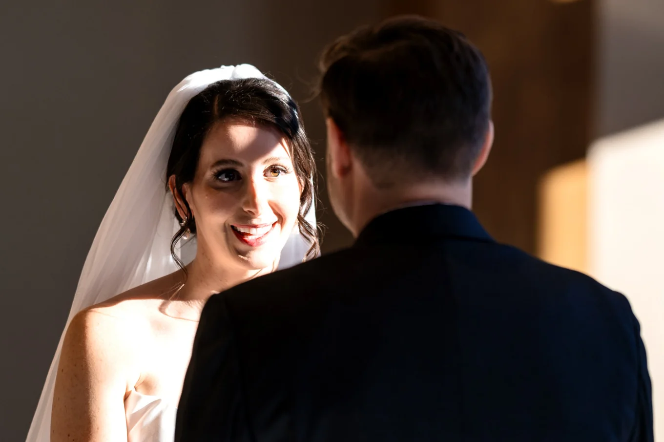 Bride looks with love on the groom