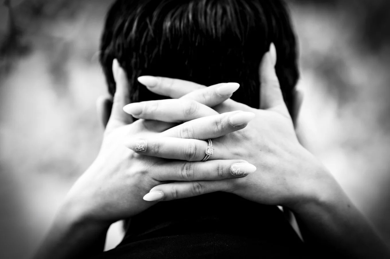 bride's hands on the grooms neck