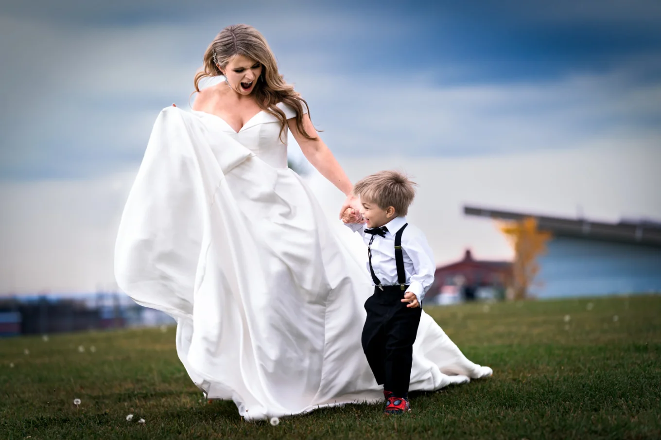 gorgeous bride runs with her son at the Edmonton Wedding