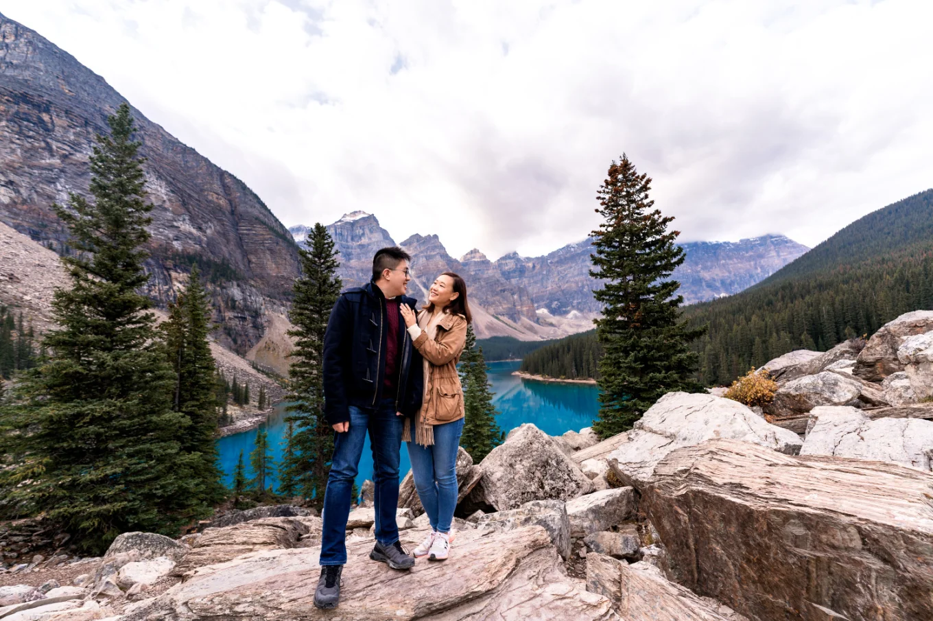 Couple in love look at each other in the mountains