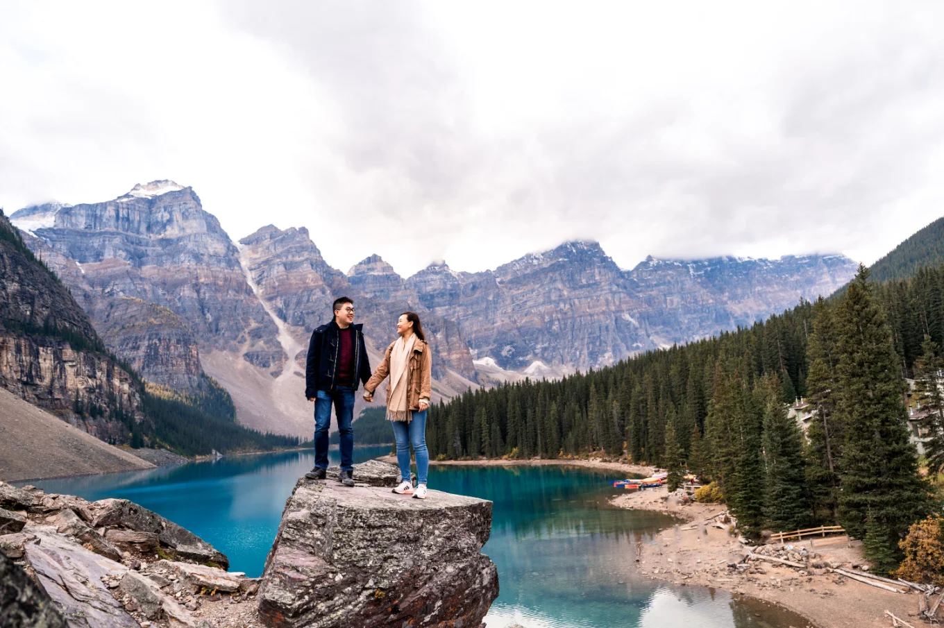 Engagement Photography of the couple holding hands against tremendous rocky mountains