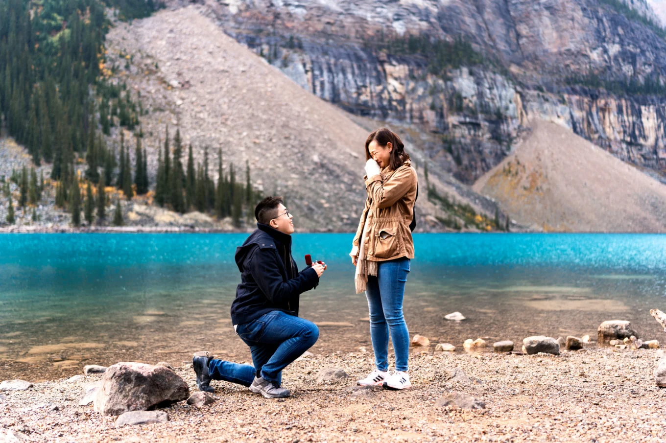 met goes down the knee at Moraine Lake and asks his girlfriend to marry him
