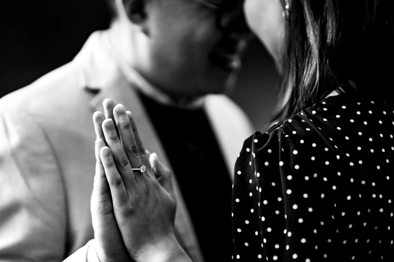engaged coupe head to head touching hands.