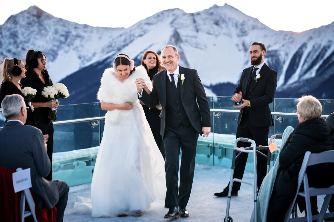 Happy newlyweds walk back the aisle.