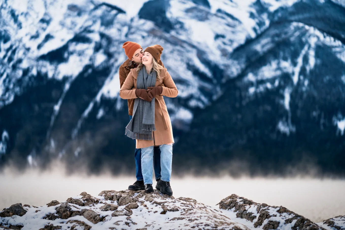 Engaged couple in a hug.