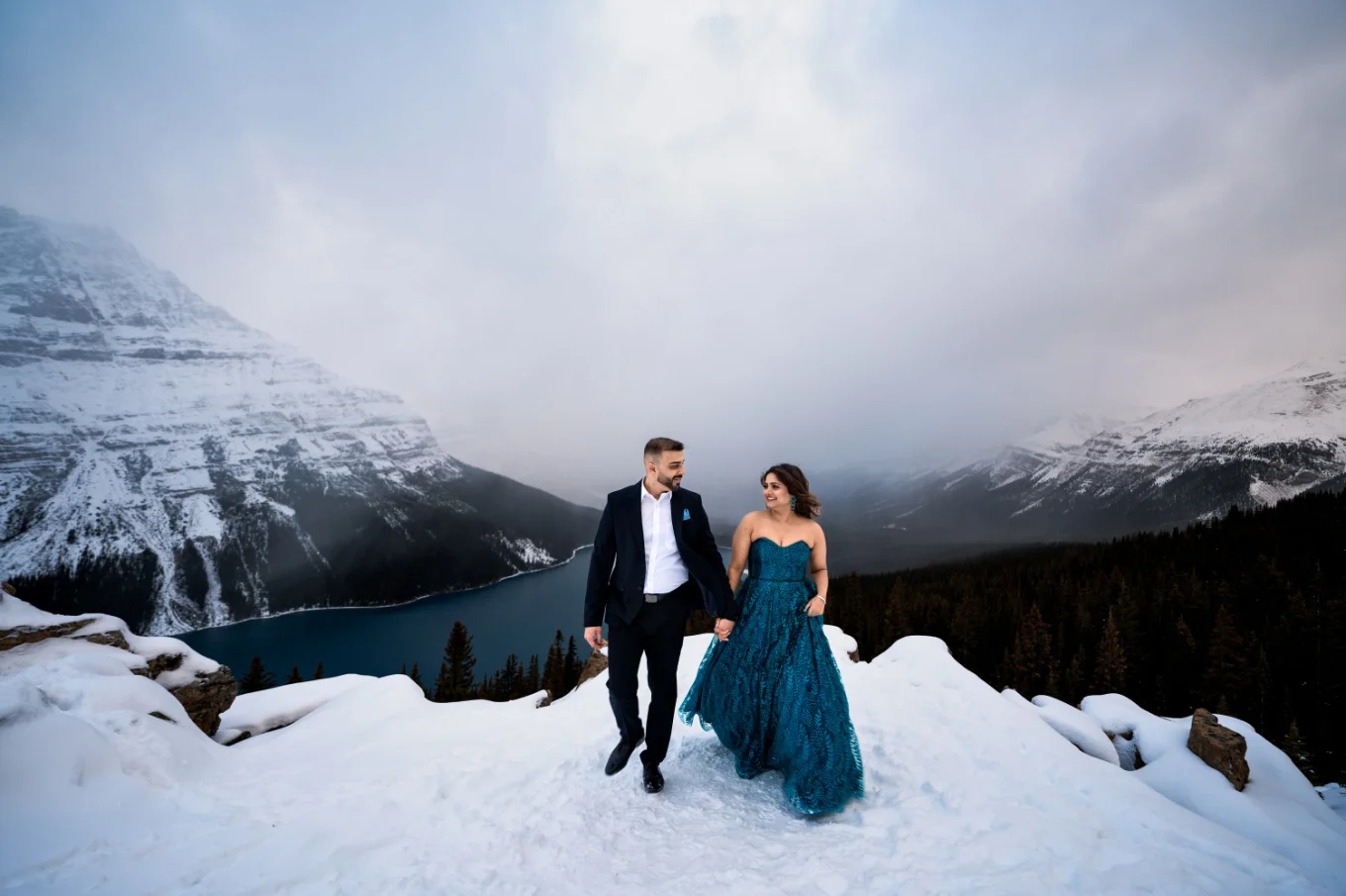 Engagement Banff Photography of the couple in love walking in winter at Peyto Lake