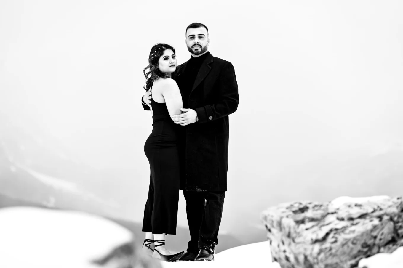 Blak and White Engagement Photography of a couple in a hug.