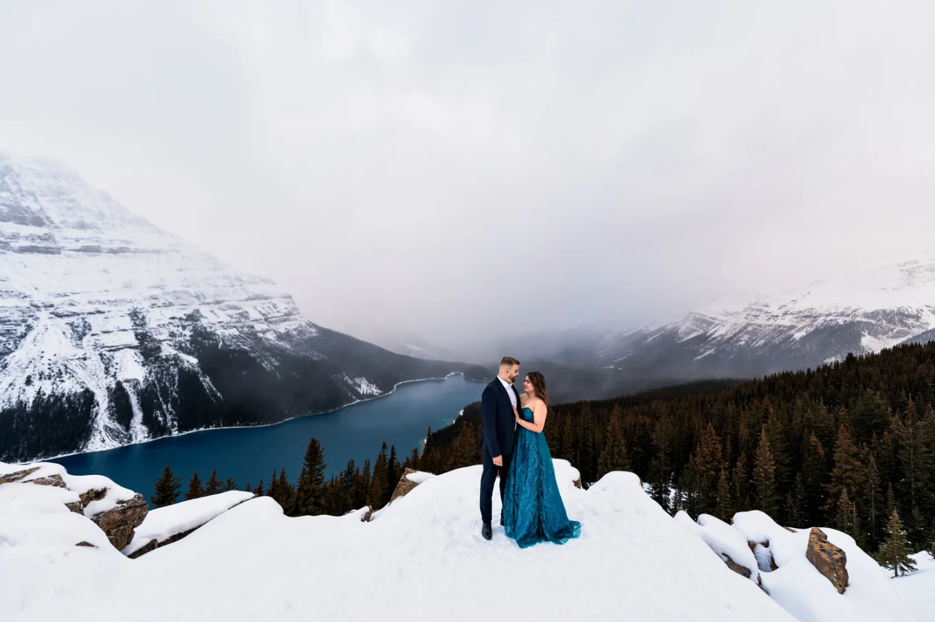 Peyto Lake Engagement Photography of the well dressed couple in a cloudy day.