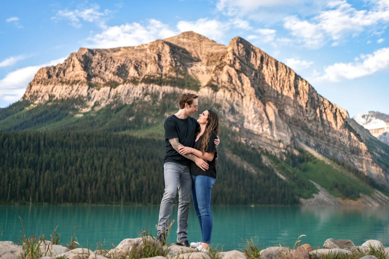 Banff Engagement Photography of the couple in love against a huge mountain