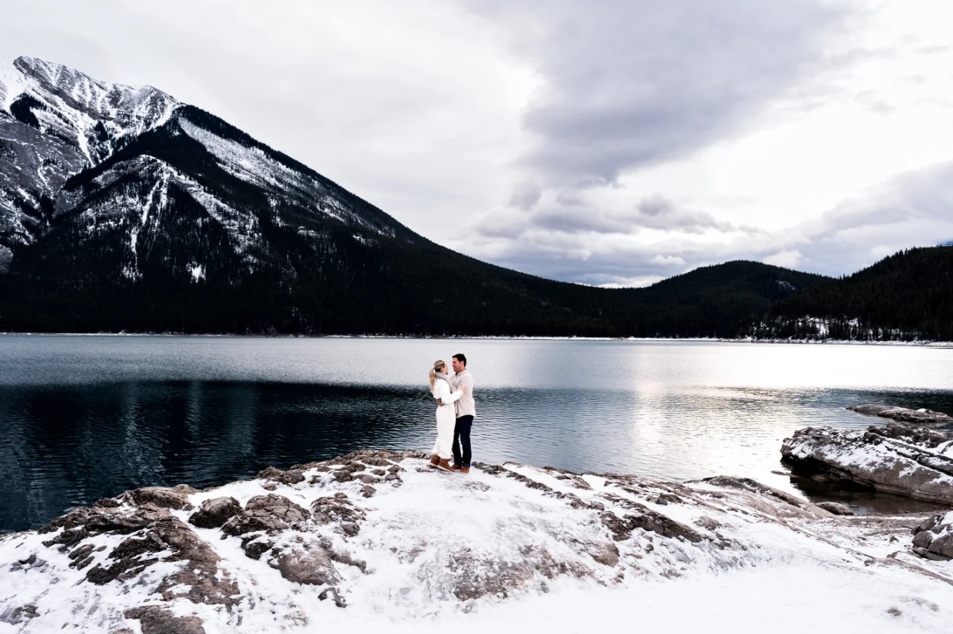 Couple in love in a hug against the Rocky Mountains