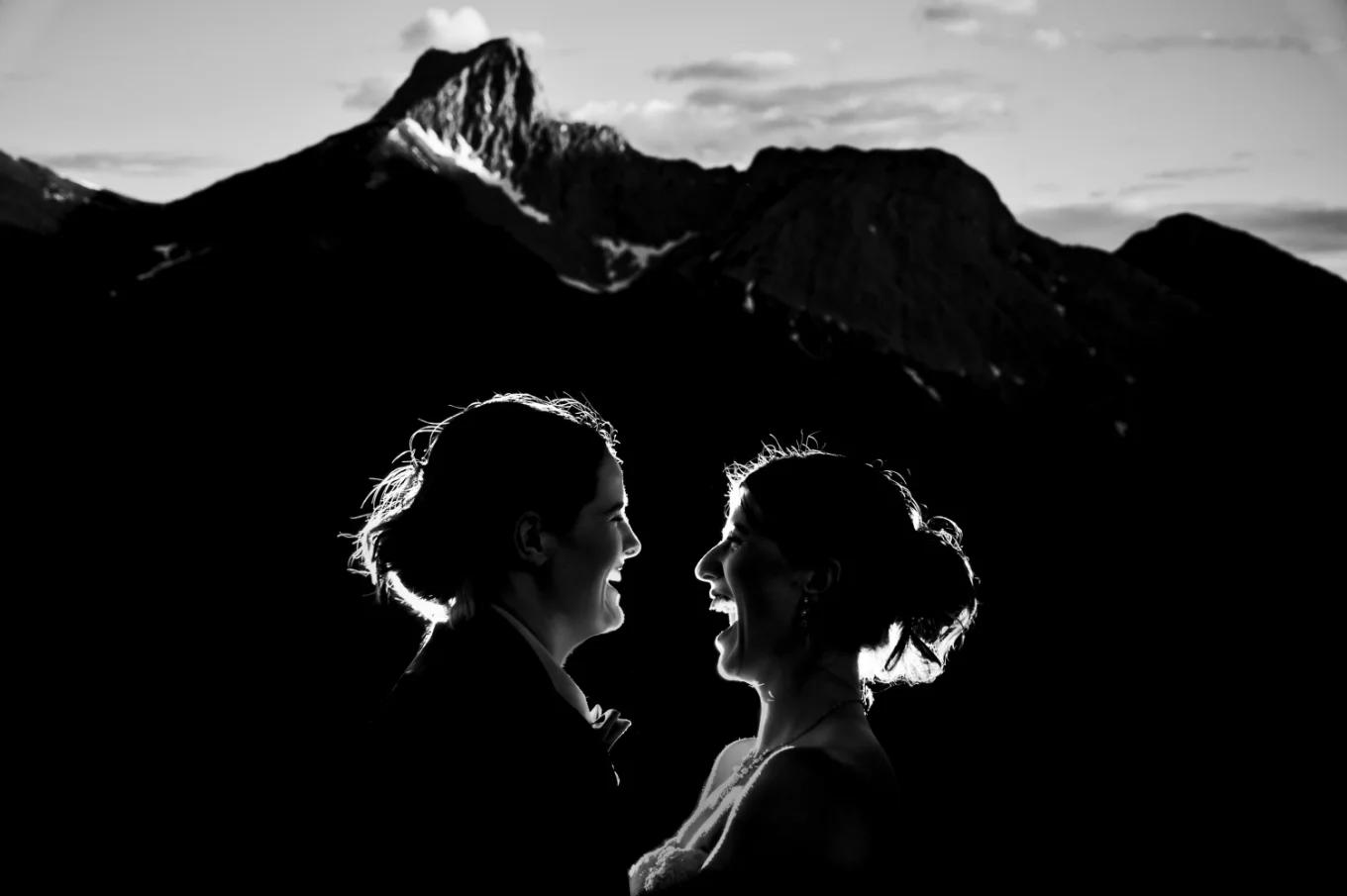 Portrait of two laughing brides