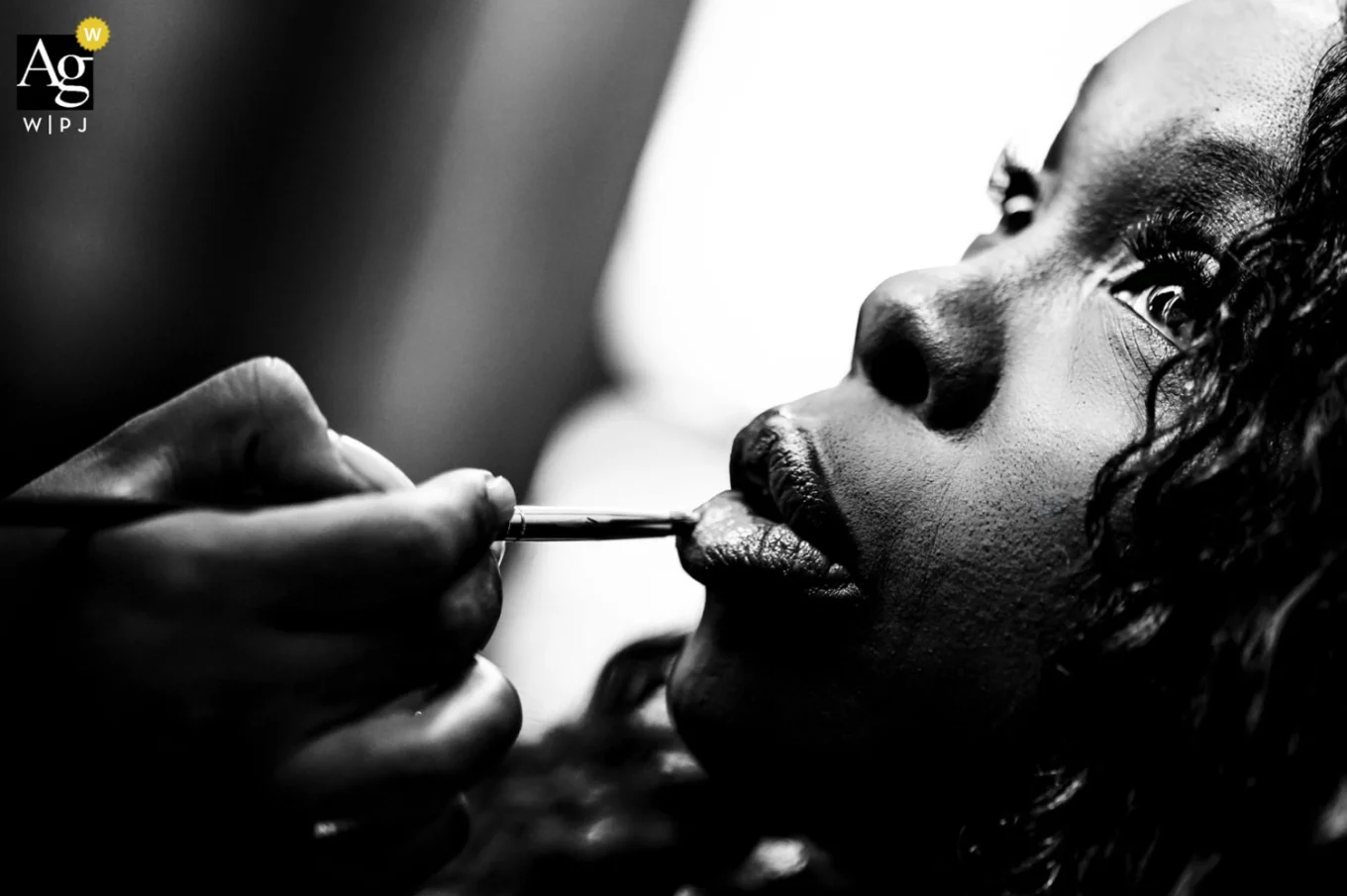 The bride is getting her lips done before Calgary Wedding Ceremony.