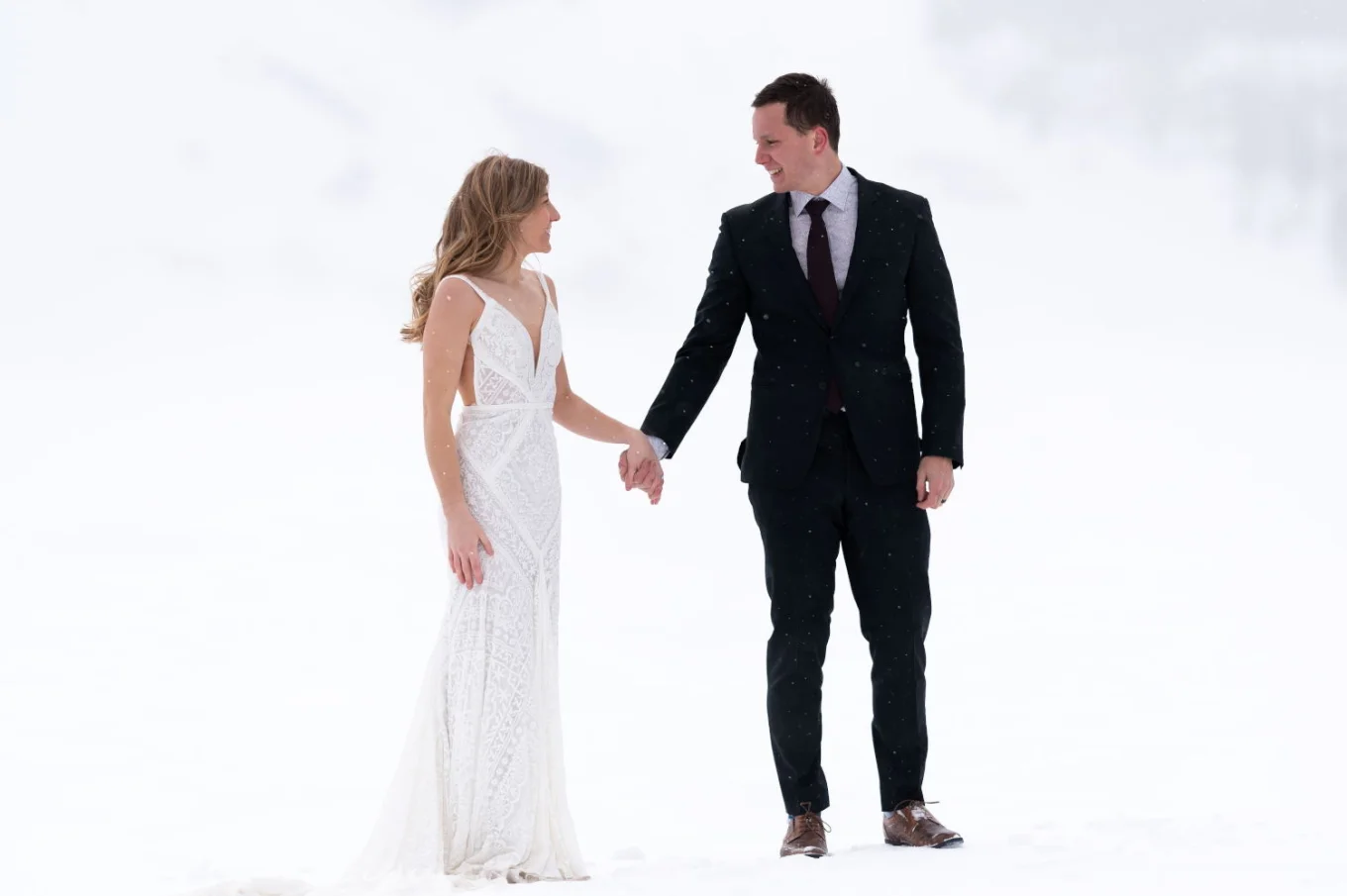 Bride and groom look at each other during their Big Day in Banff
