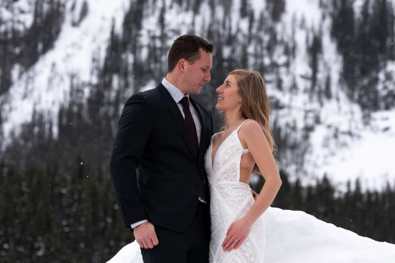 bride and groom look deeply into each others eyes during Banff Wedding Photo session