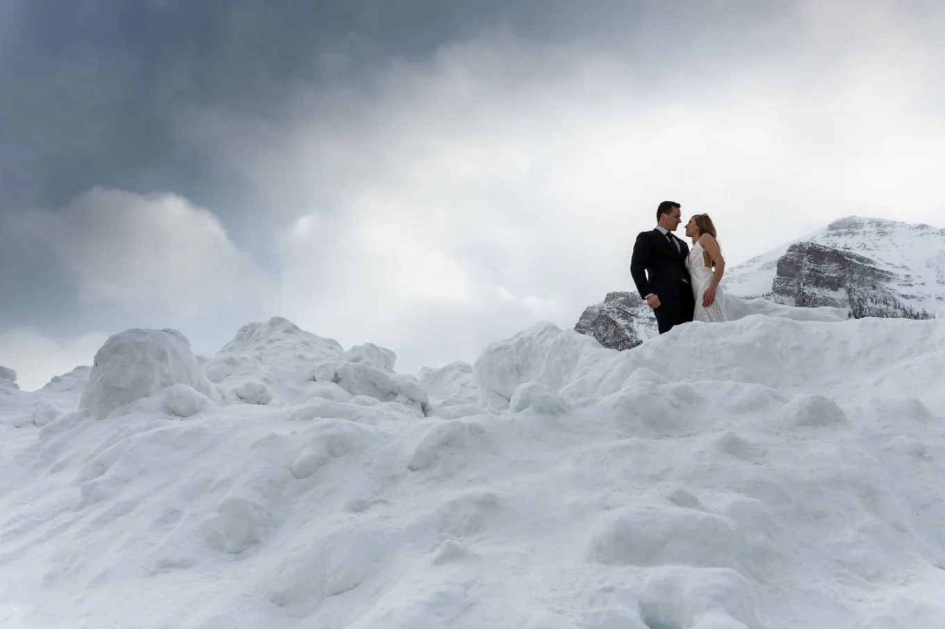 Newlyweds on the top of the mountain in Banff