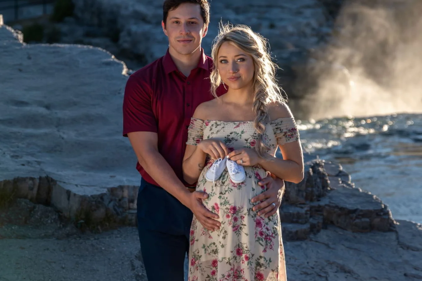 Future parents posing during maternity photo shoot in Banff.
