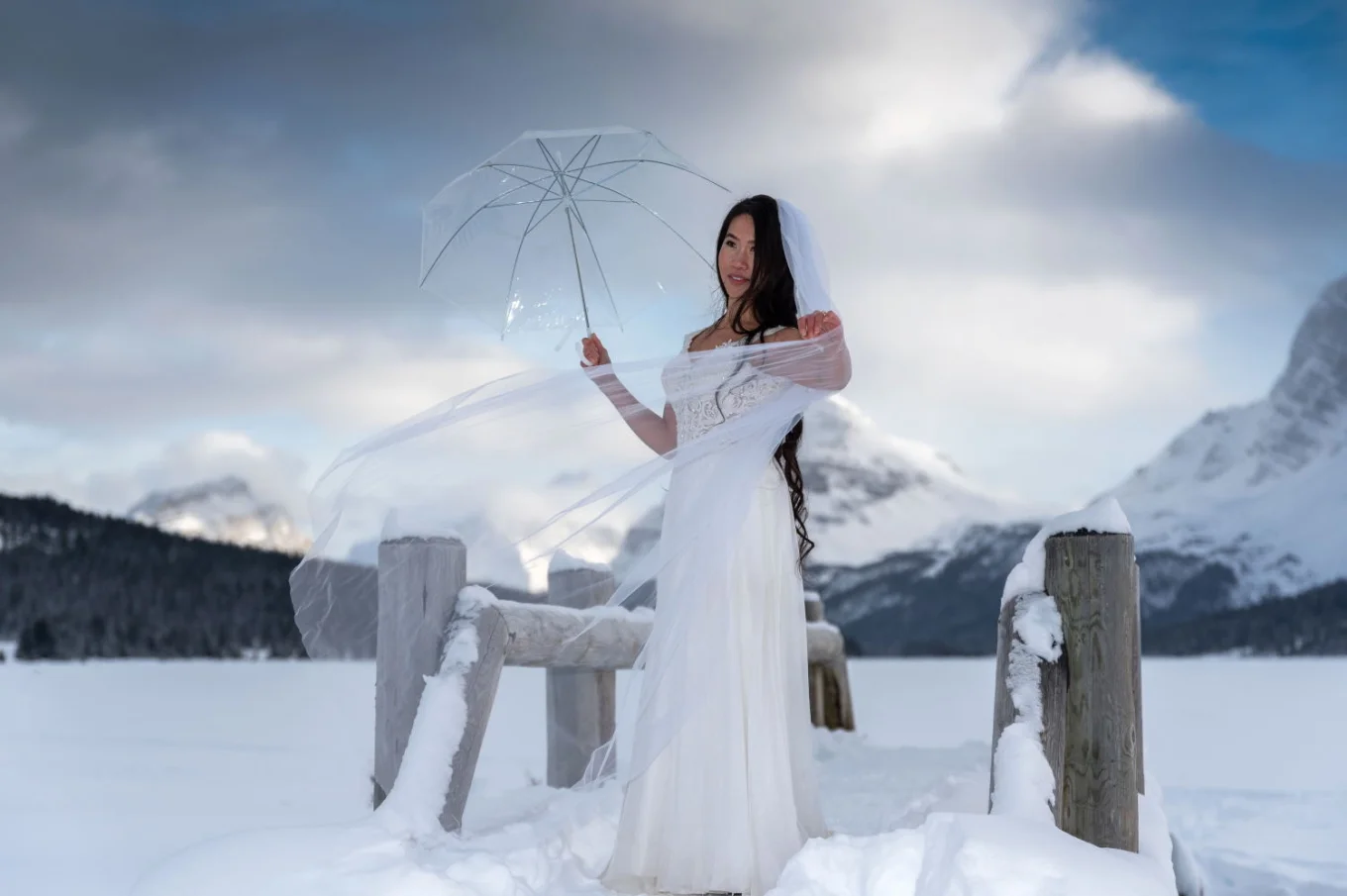 Bride holds an umbrella