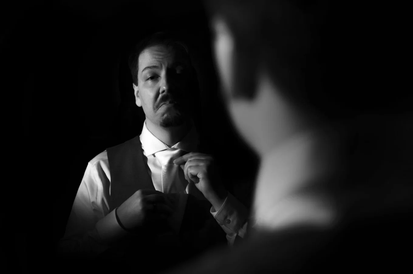 groom fixing the tie