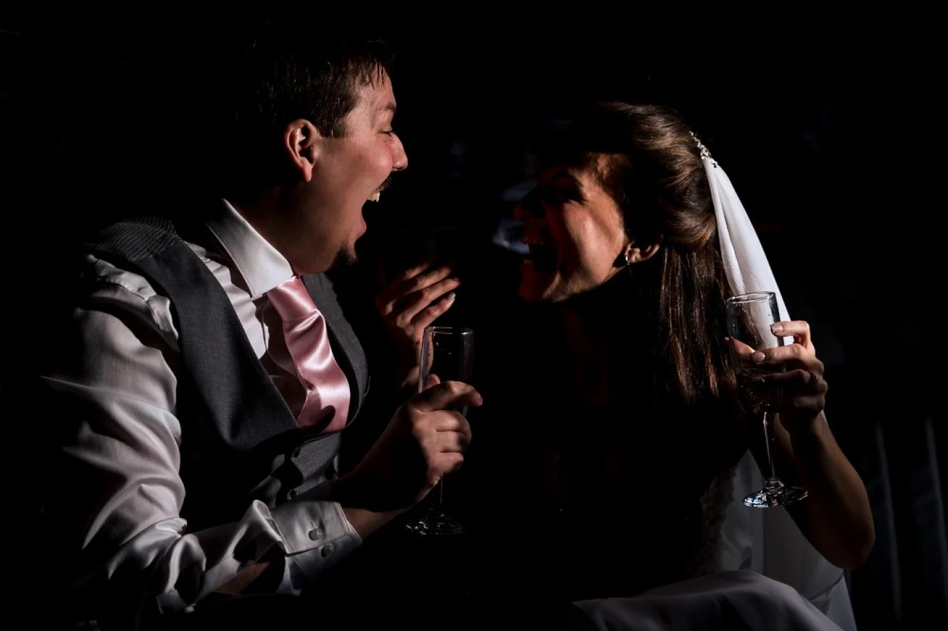 Bride and Groom in the limo with Calgary Wedding Photographer