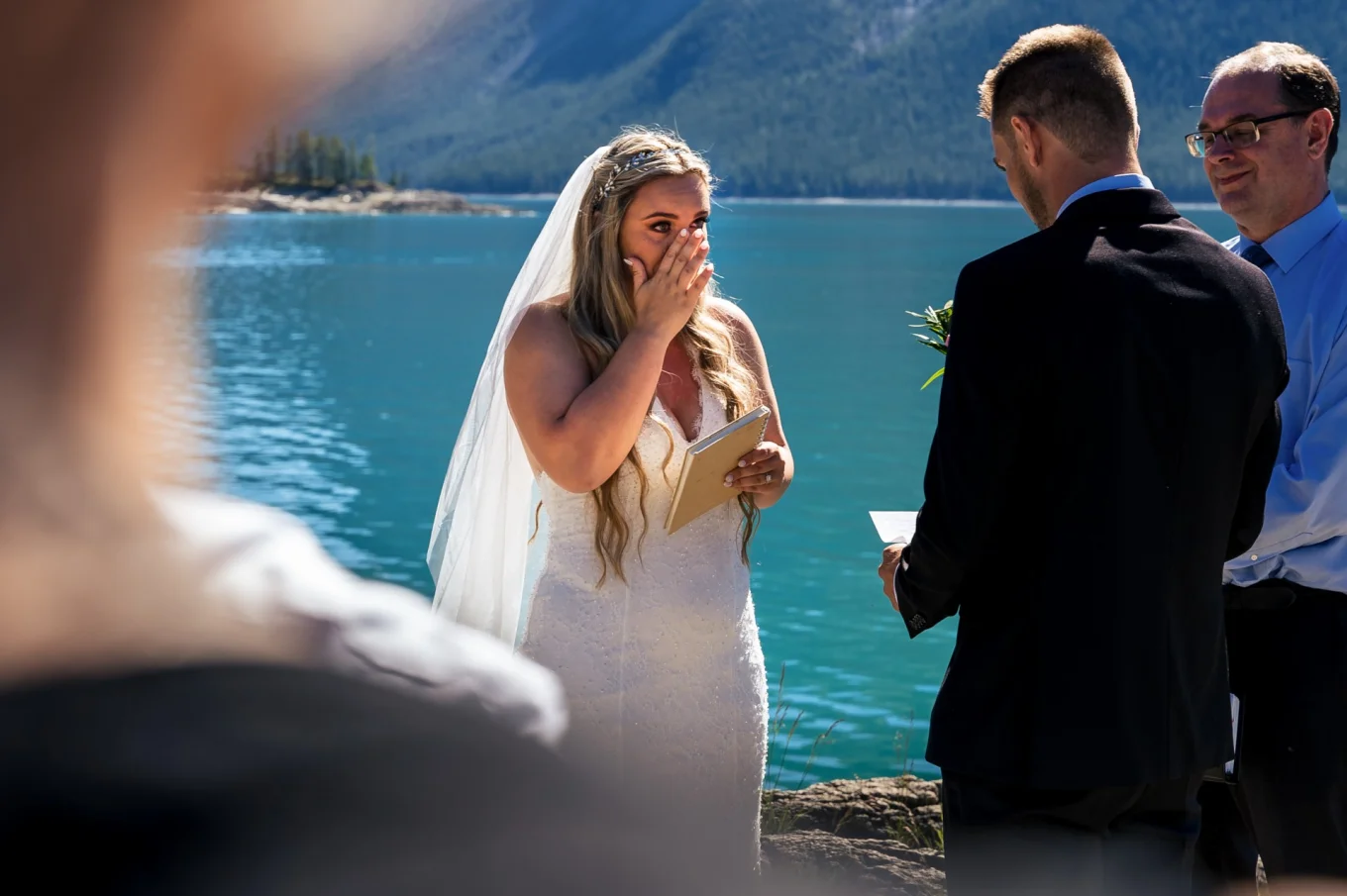 Bride cries during elopement ceremony in Banff